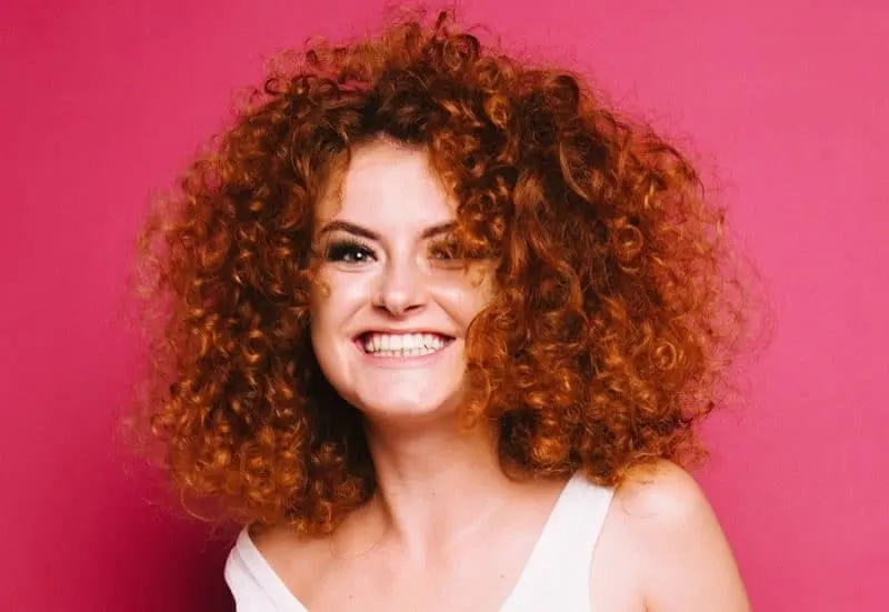 curly auburn hair with copper red highlights