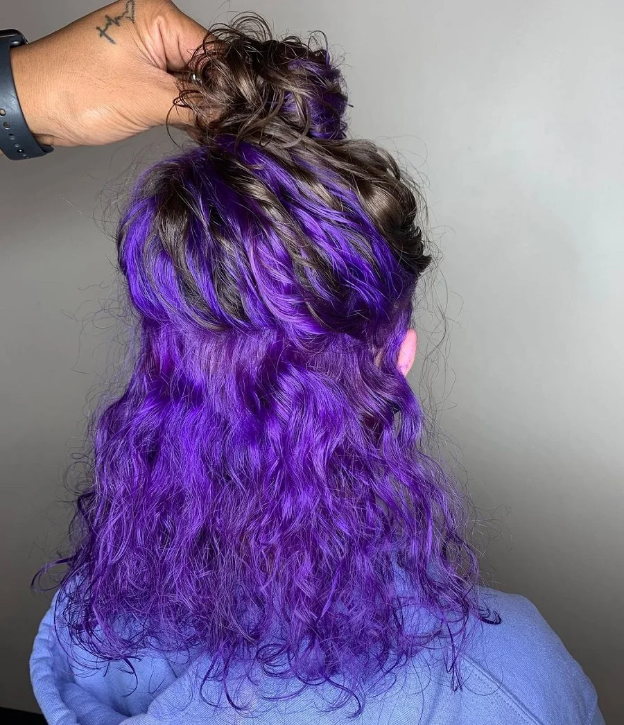 curly black hair with purple underneath