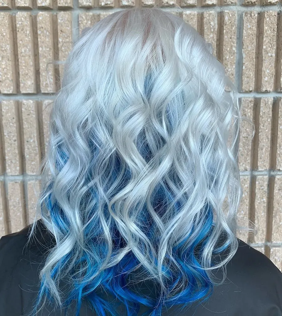 curly blonde hair with blue underneath