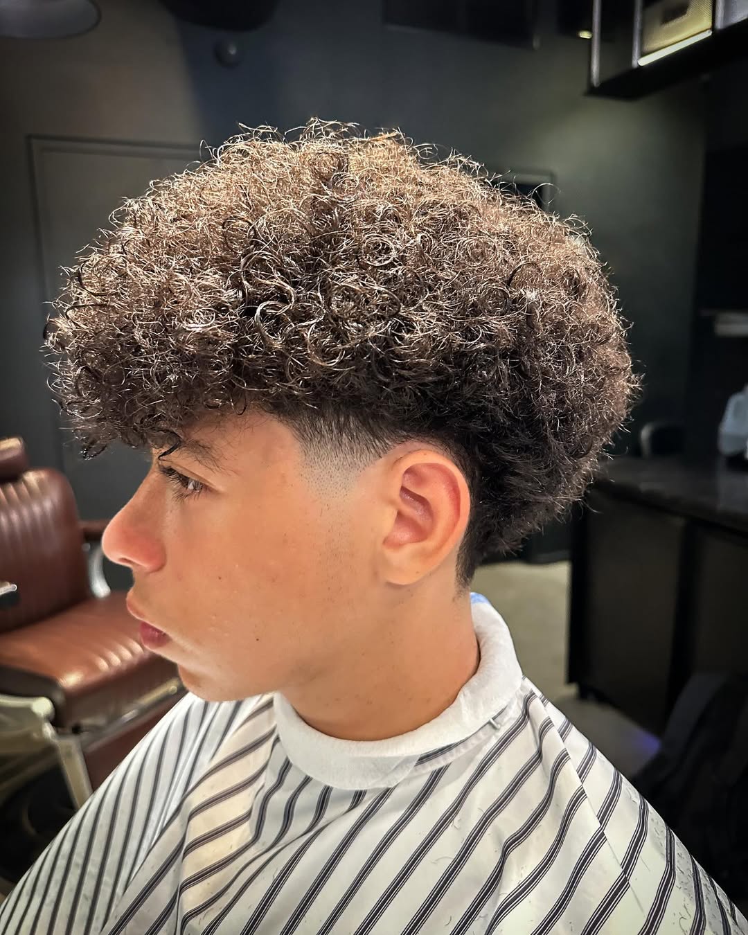 Curly blowout taper fade haircut