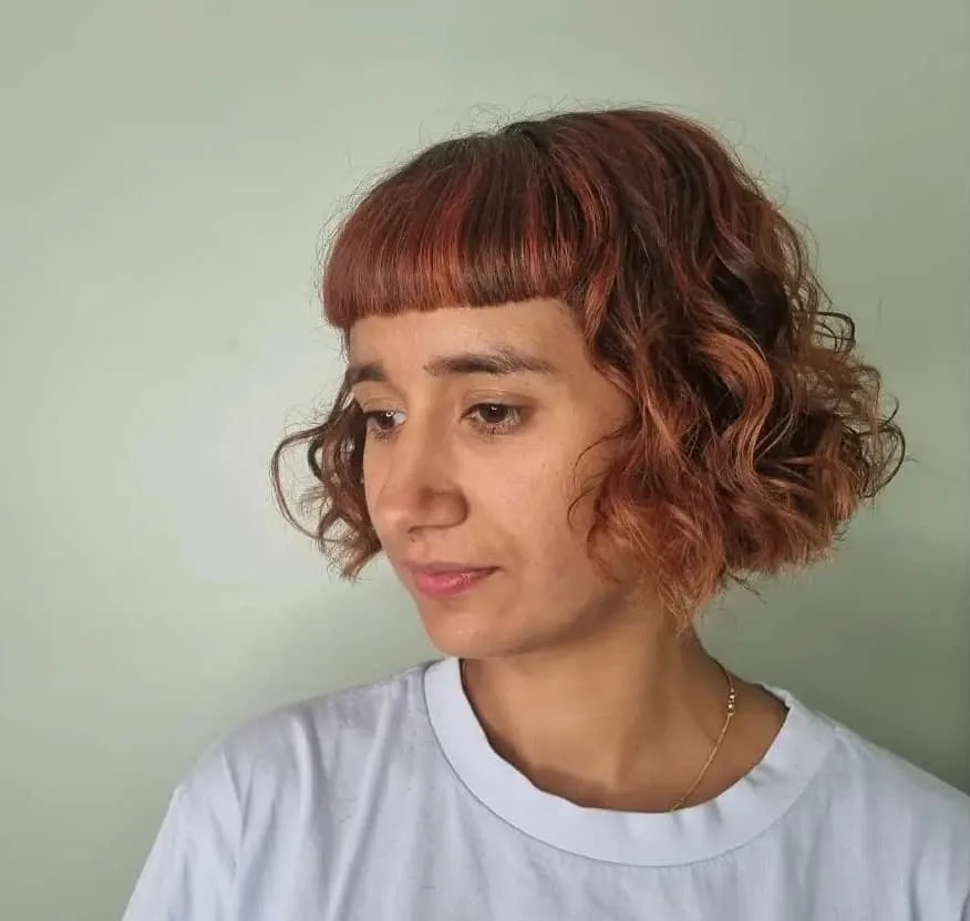 curly blunt bob with baby bangs
