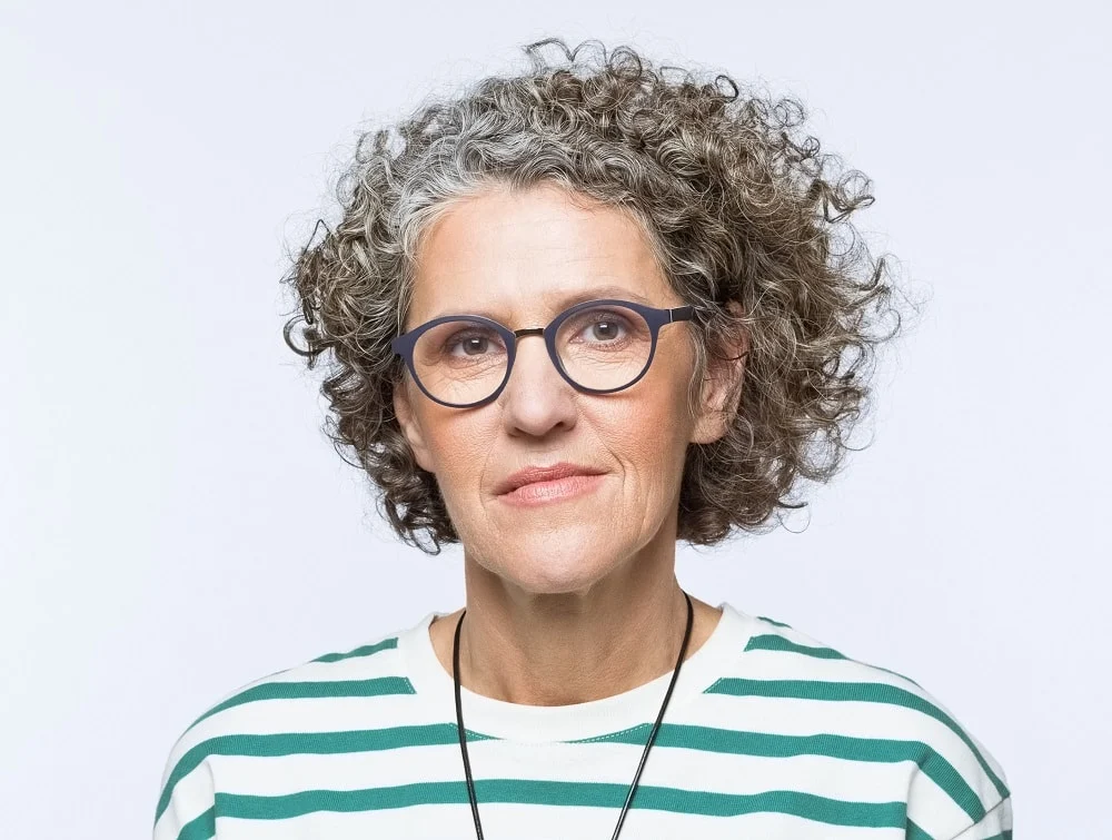 curly bob for over 50 with glasses
