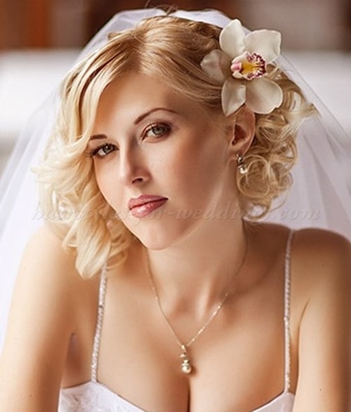 Curls with flower wedding hairstyle for women