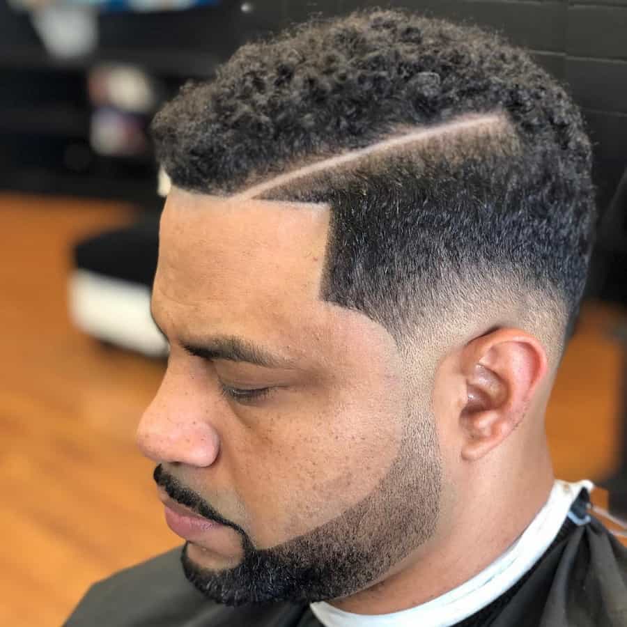 curly comb over with taper fade