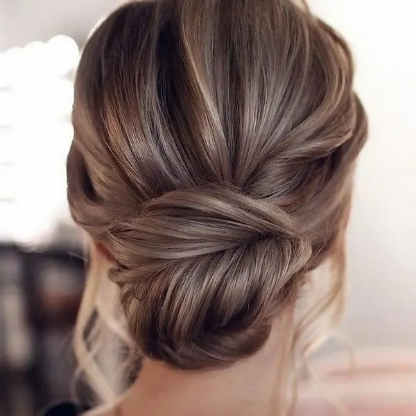 messy chignon with curly frizzy hair