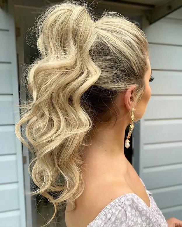 high ponytail with curly frizzy hair