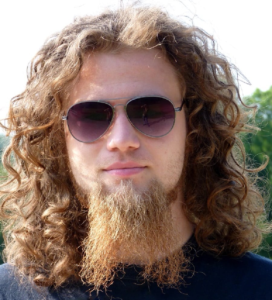 curly hair with French fork goatee beard
