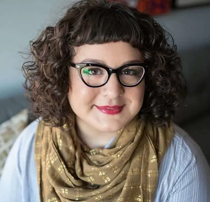 curly hair with bangs and glasses