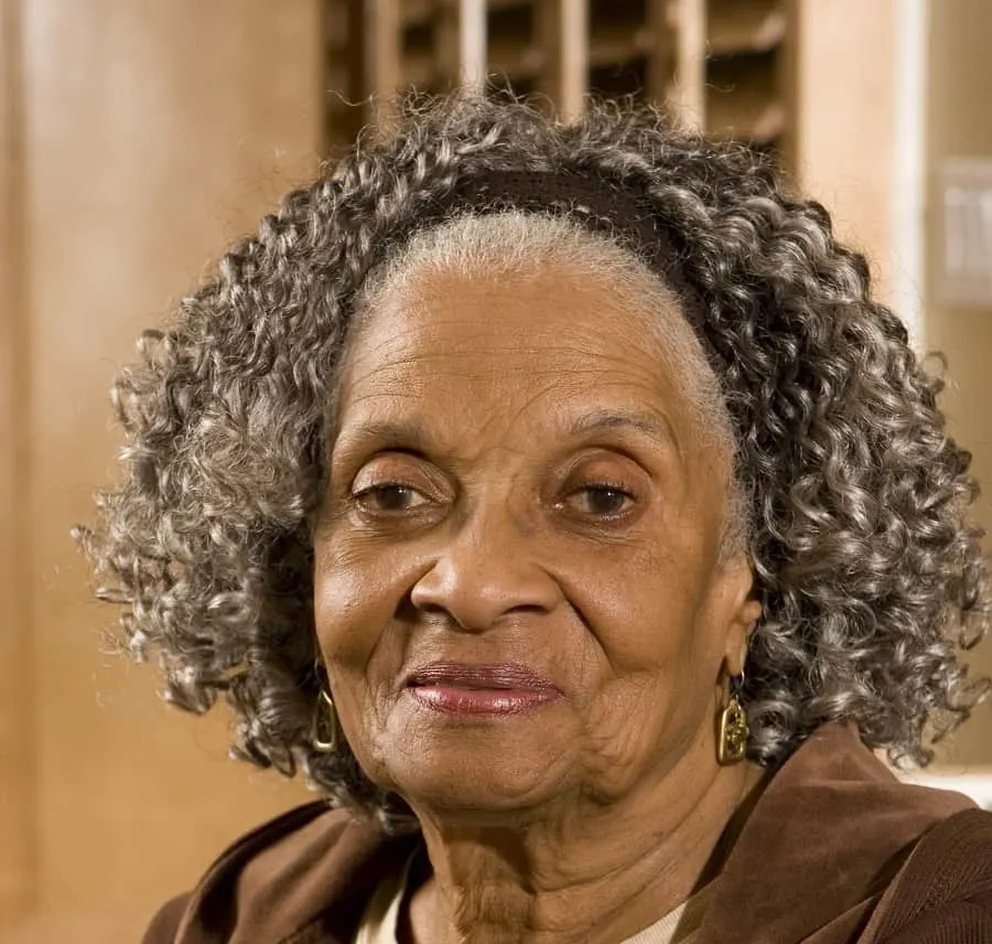 curly hair with headband for older women