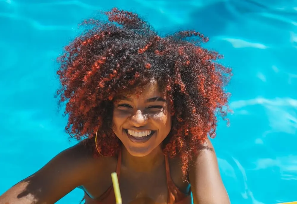 curly hair with orange highlights