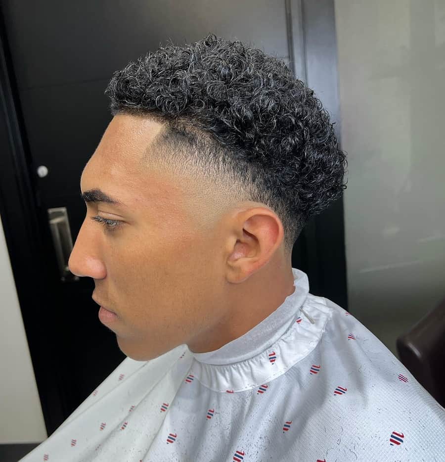curly haircut with taper fade