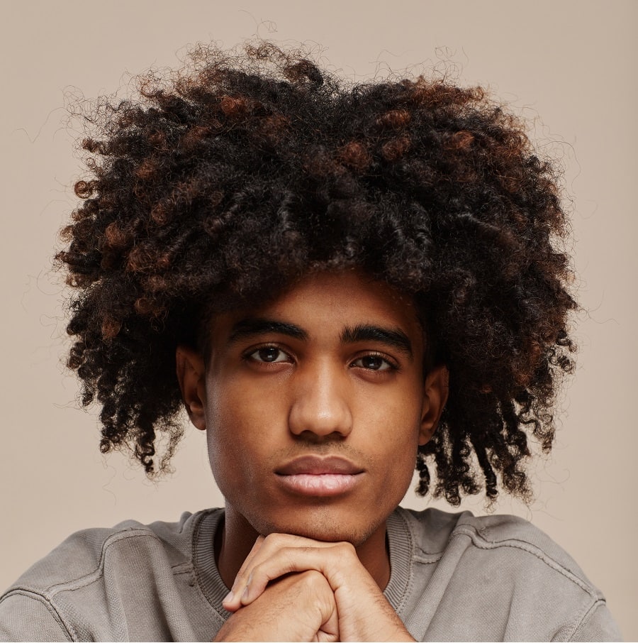 curly hairstyle for black teenage guys
