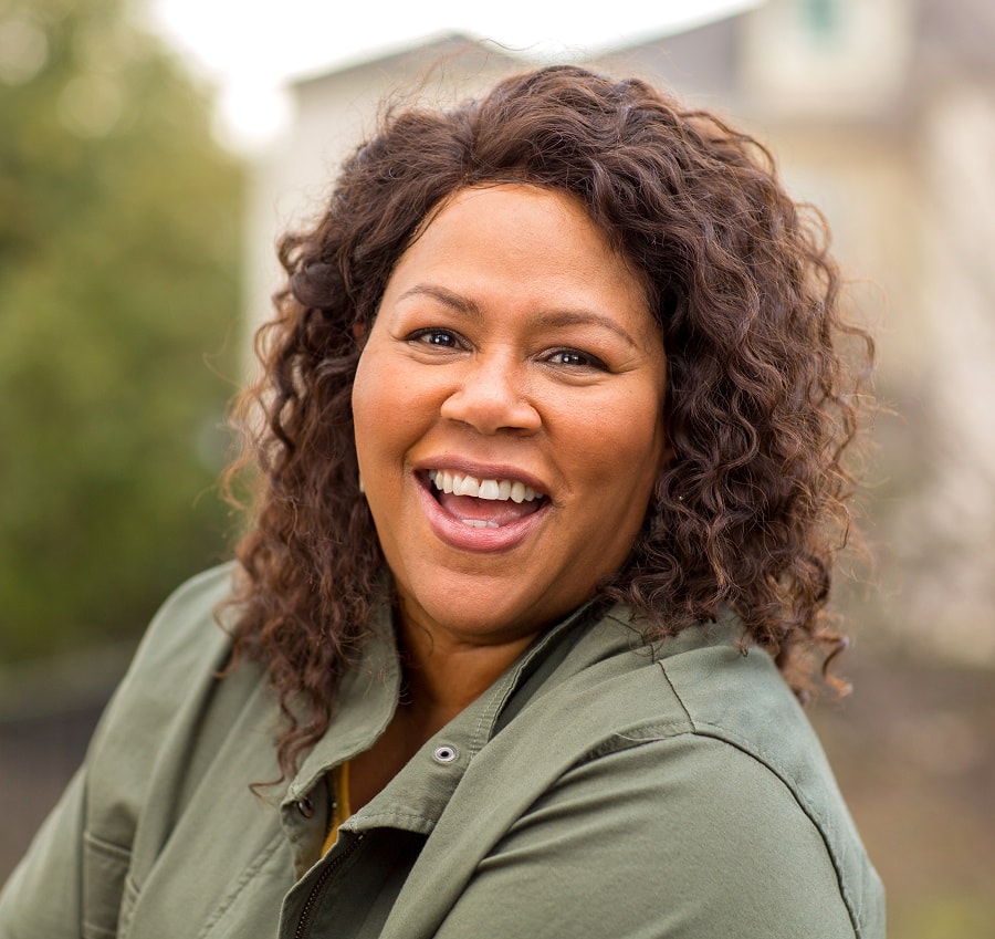 Curly hairstyle for overweight women with oval faces