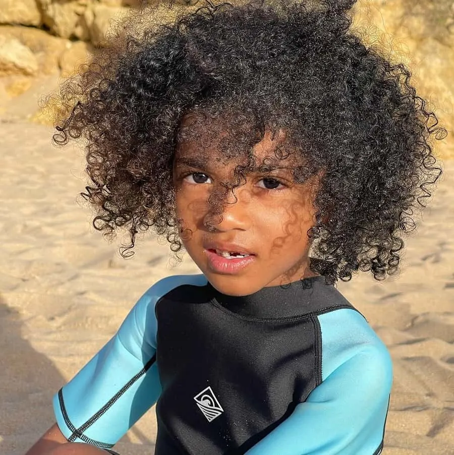 curly hairstyle for surfer boys