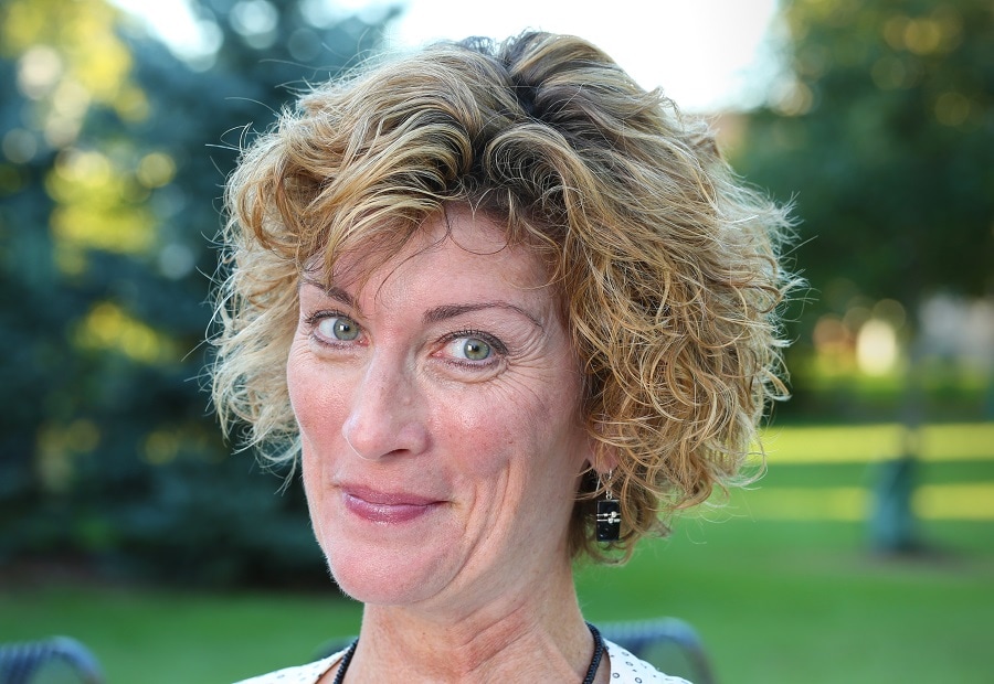 curly hairstyle for women over 60 with highlights