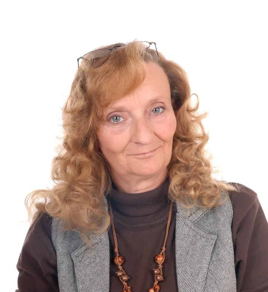 curly hairstyle for women over 60 with long faces