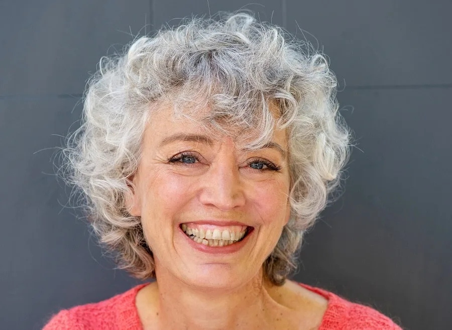 curly hairstyle with bangs for women over 60