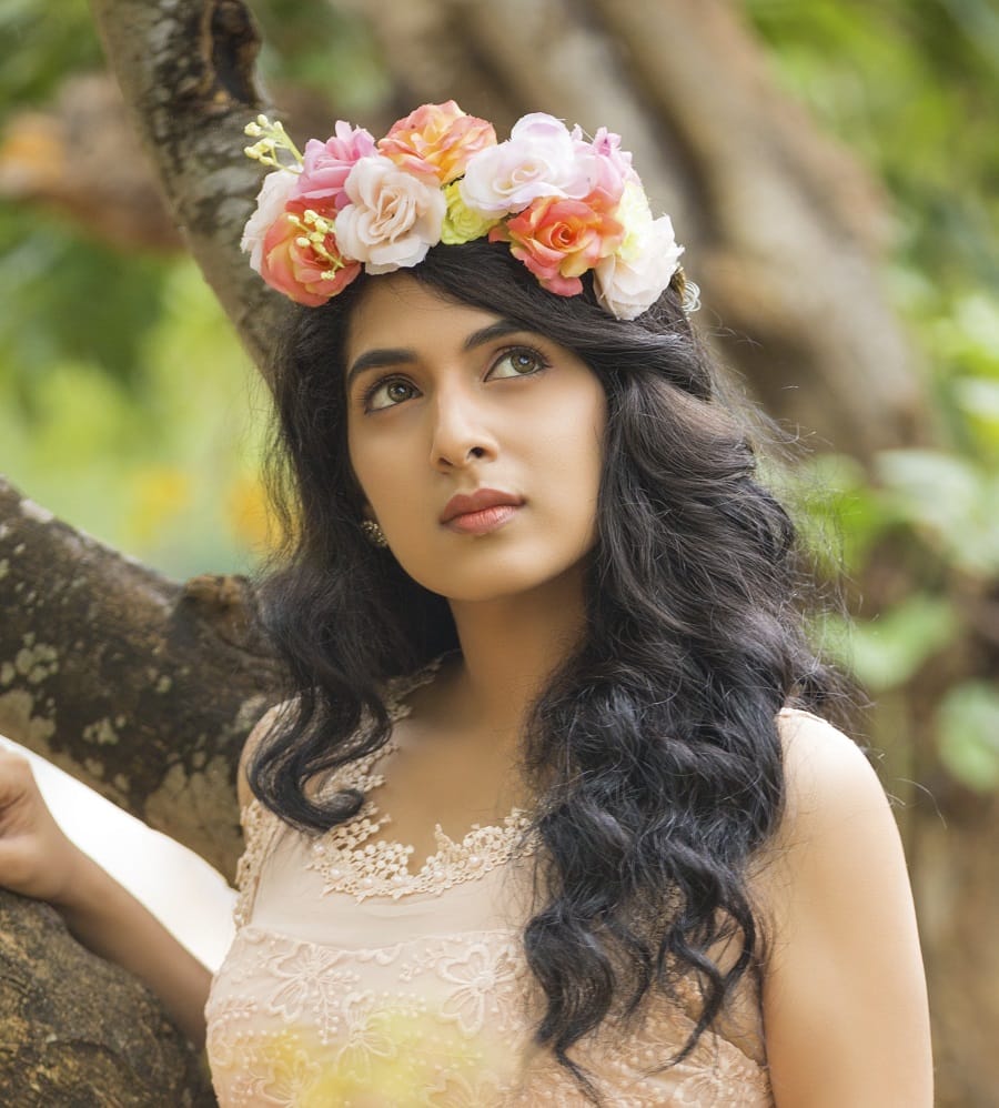 curly hairstyle with flower for indian women