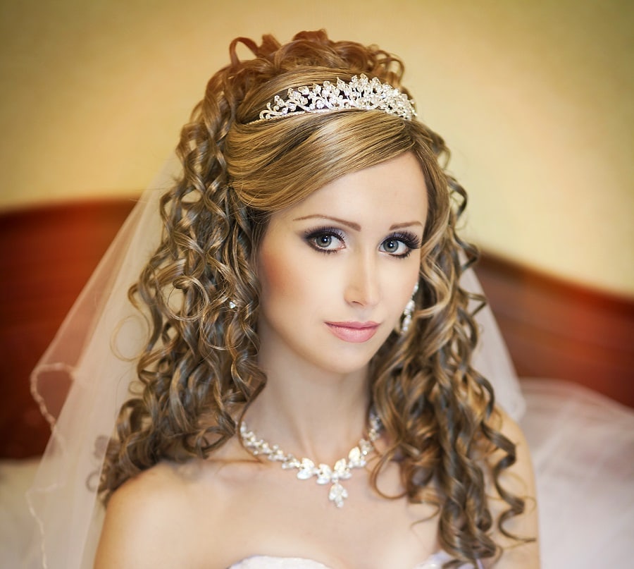 curly hairstyle with tiara and veil for wedding