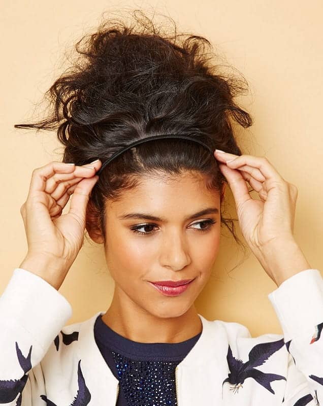 curly top knot with a headband