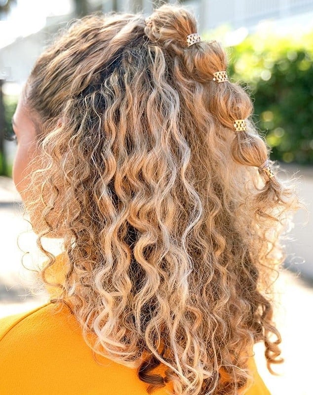 curly half up half down ponytail