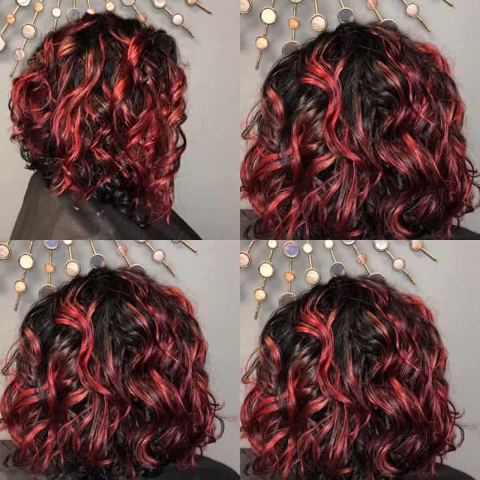 inverted curly bob with red highlights