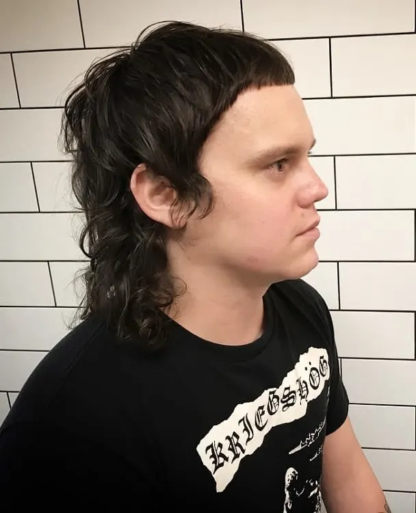 curly hair mullet with short bangs
