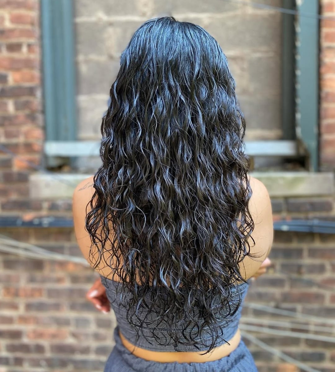 long dark curly perm on thin hair