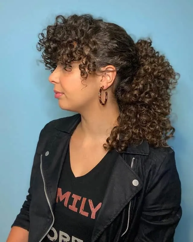 curly ponytail with bangs