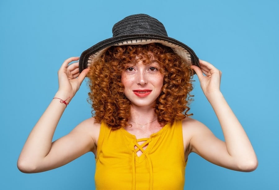copper curly shag with tight ringlets and rounded bangs