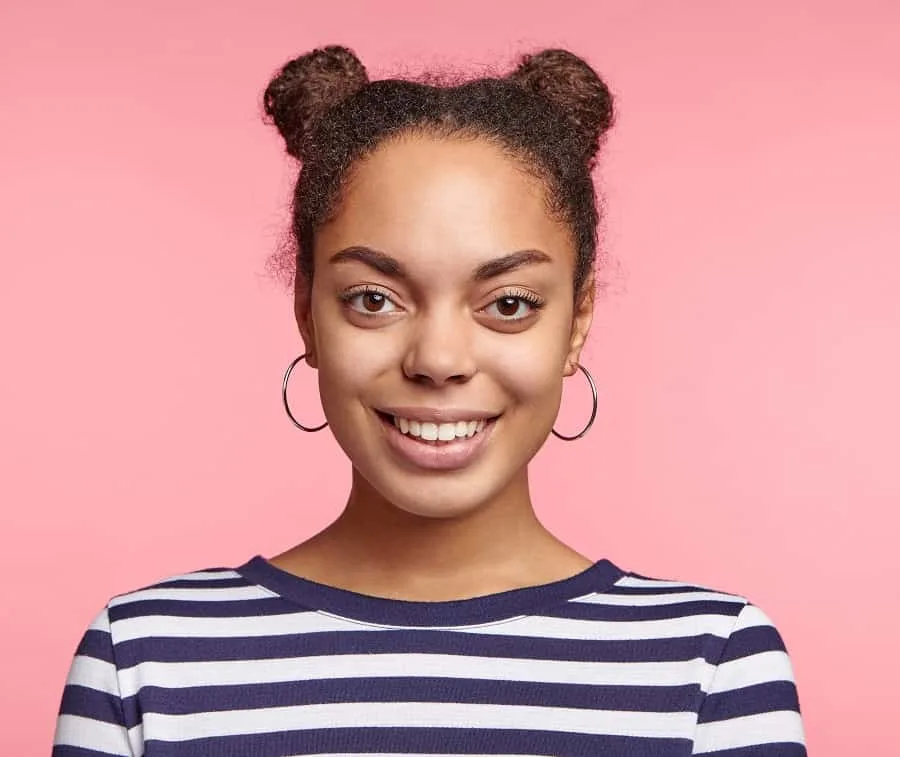 curly space buns with middle part