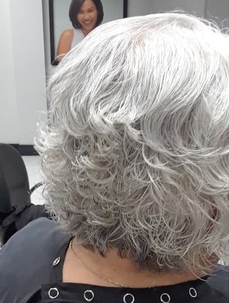curly platinum stacked bob for women