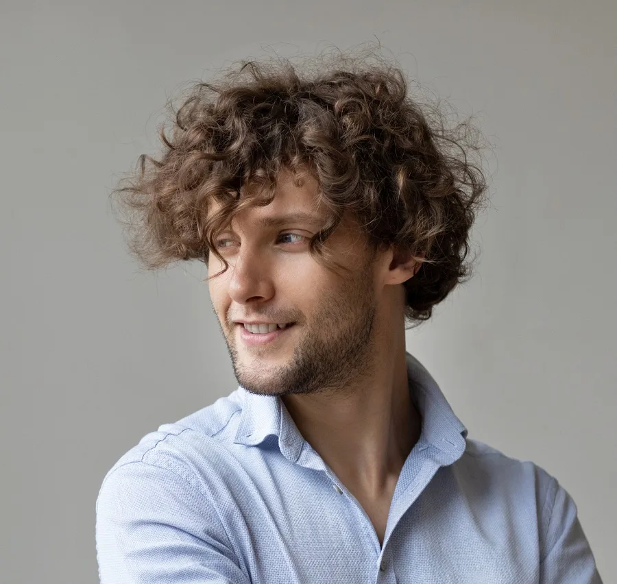 curly tousled hairstyle for men