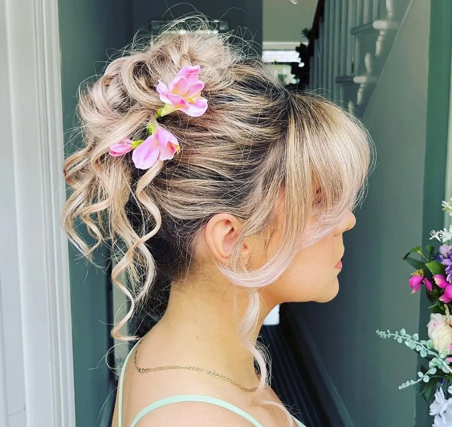 curly updo with blonde curtain bangs