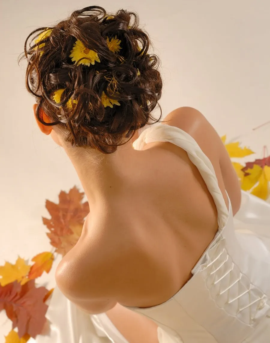 curly updo with one shoulder wedding dress