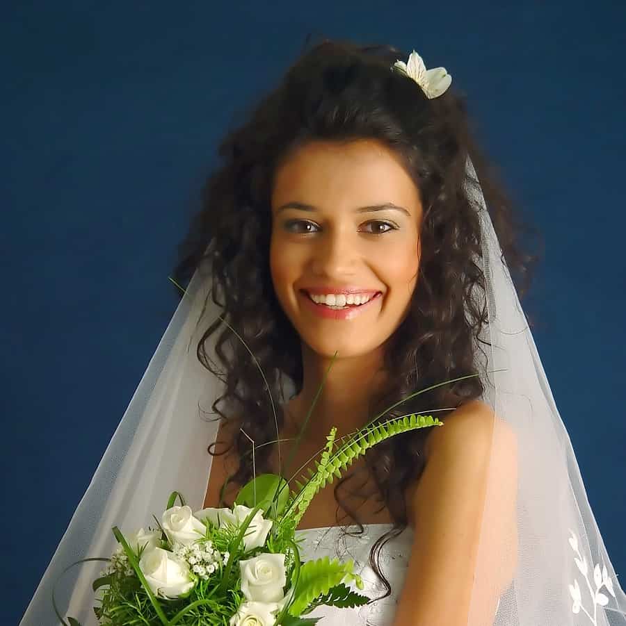 curly wedding hairstyle with veil