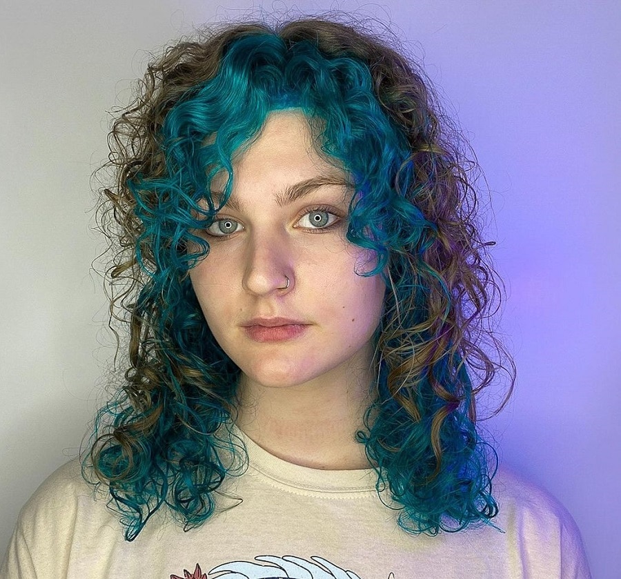 curly wolf cut with blue highlights