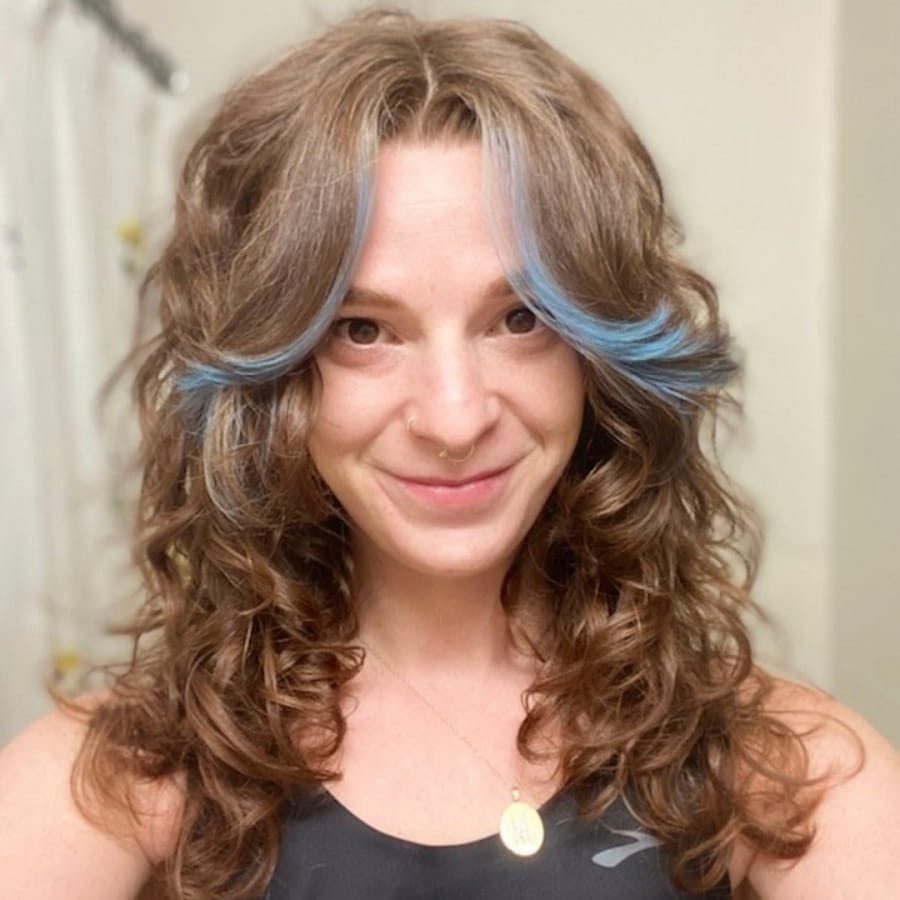 curtain bangs on curly hair with layers