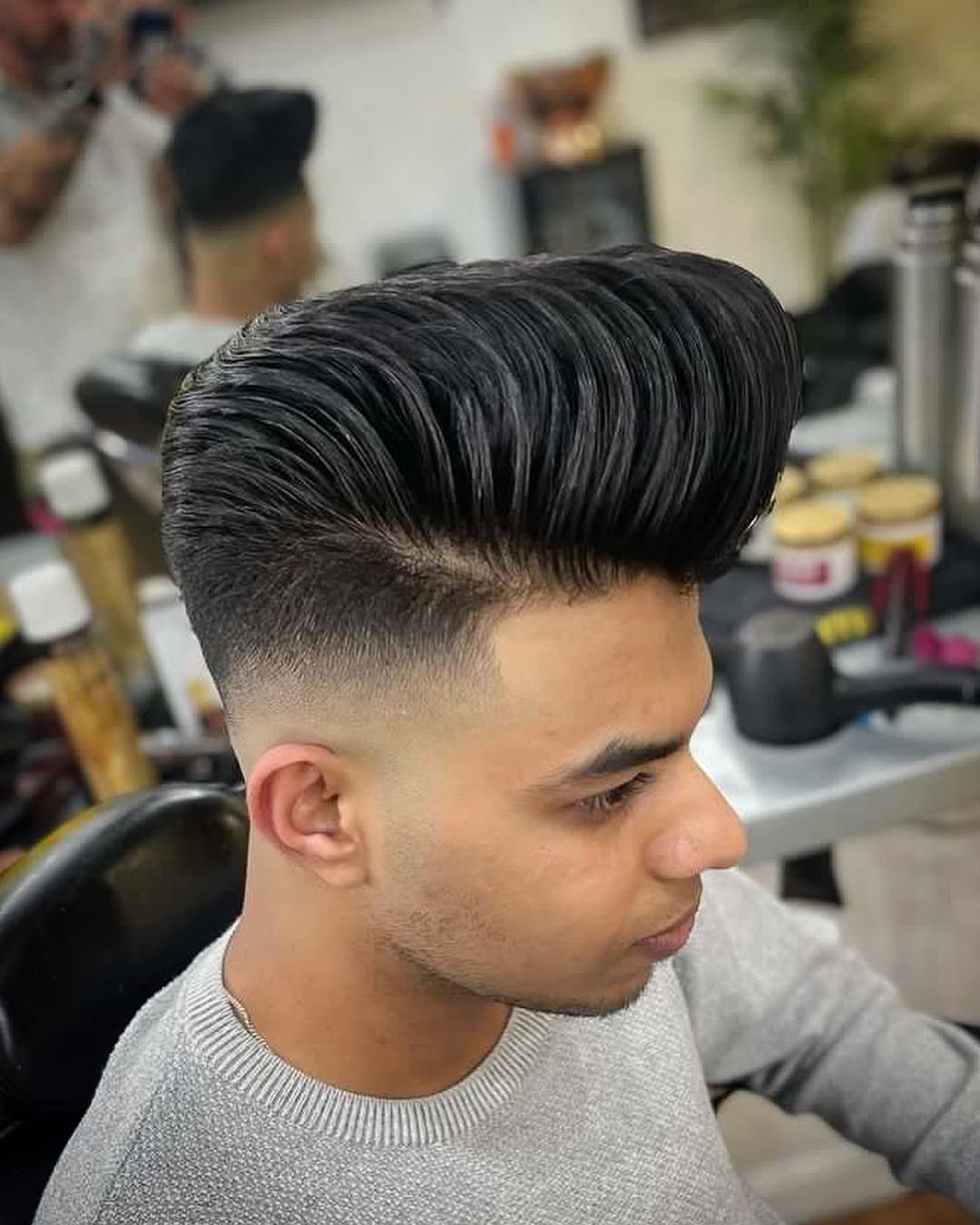 high-volume disconnected pompadour with skin fade