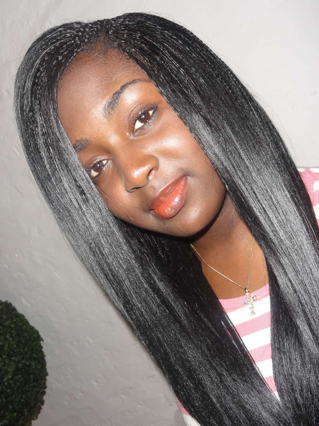 sleek center-part straight tree braids