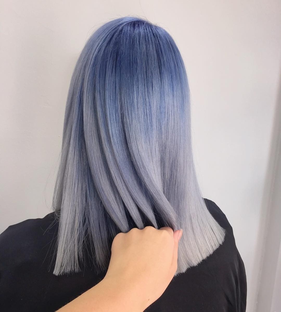 Pin-straight blunt long bob with a dusty blue-to-silver balayage gradient