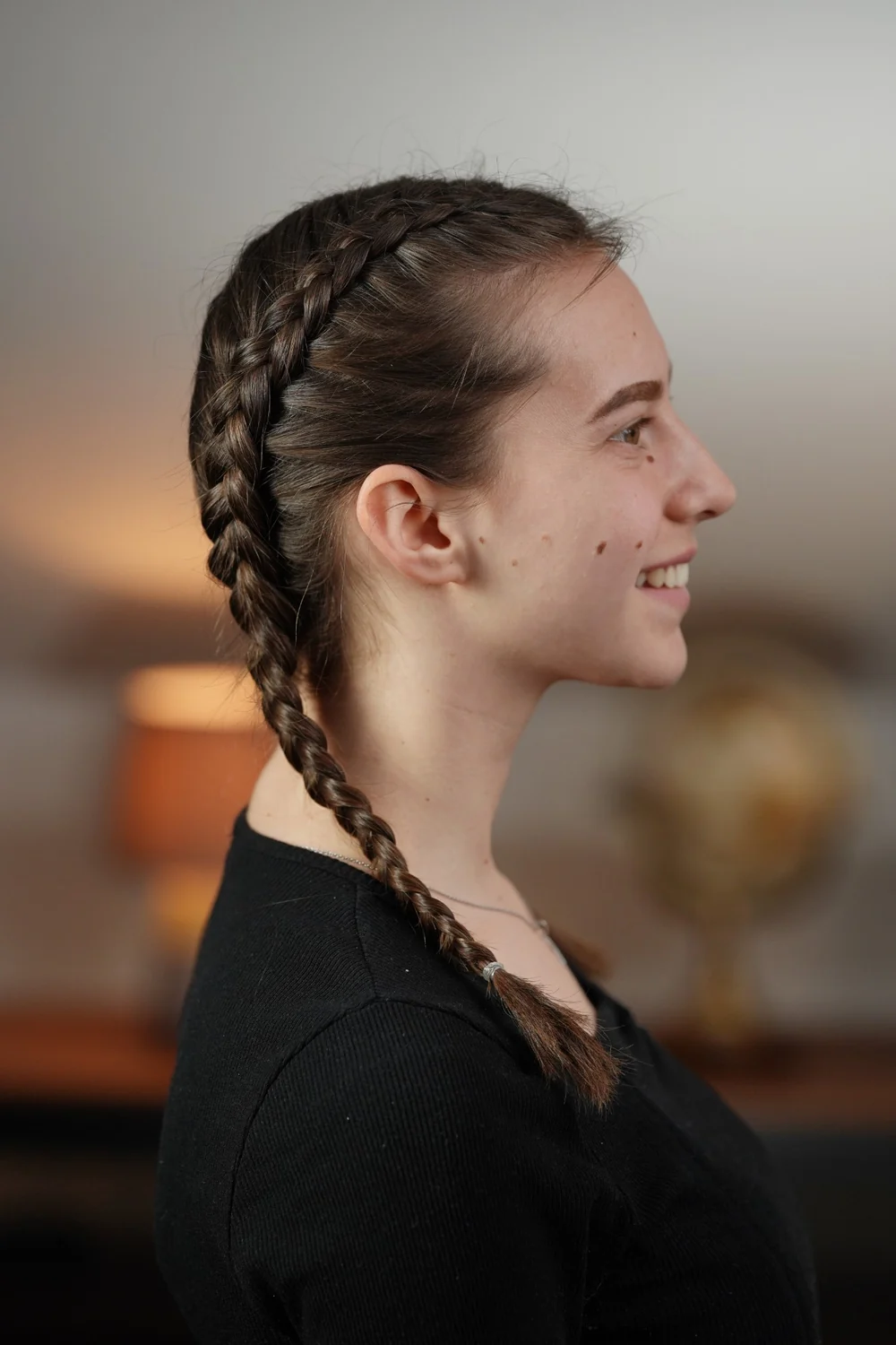 Side view of a Dutch braid: the plait sits raised on top of the hair because the strands are crossed underneath