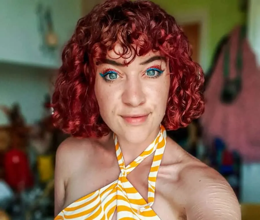 dyed curly bob with bangs