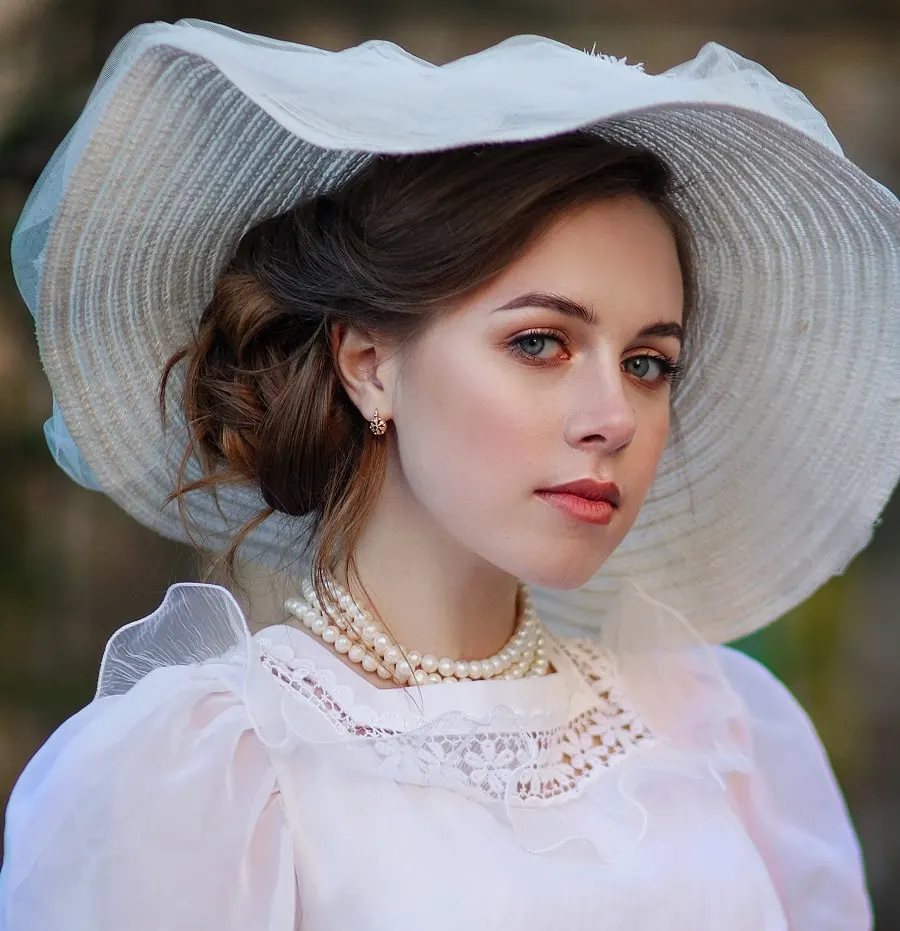 edwardian hairstyle with a hat