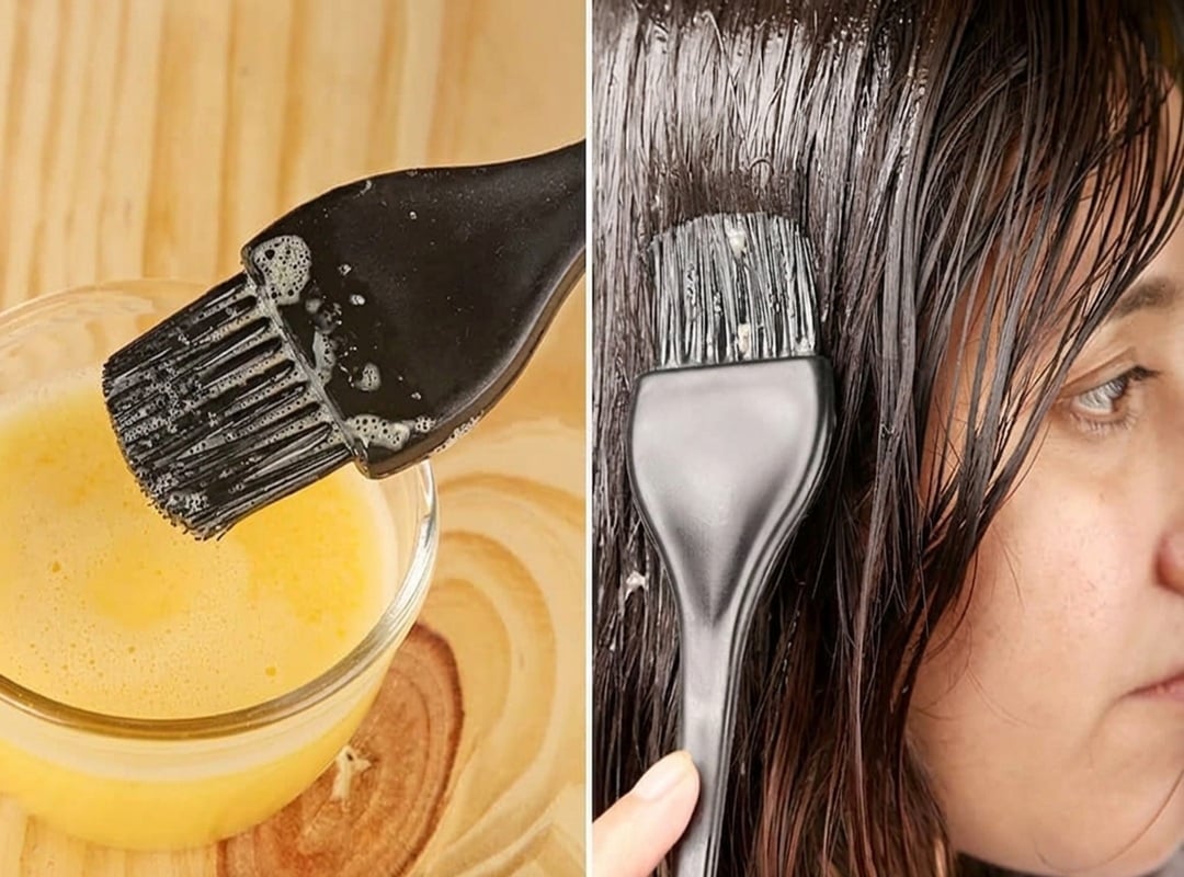 Whisked egg and honey hair mixture being brushed onto wet hair for a homemade natural hair moisturizer recipe