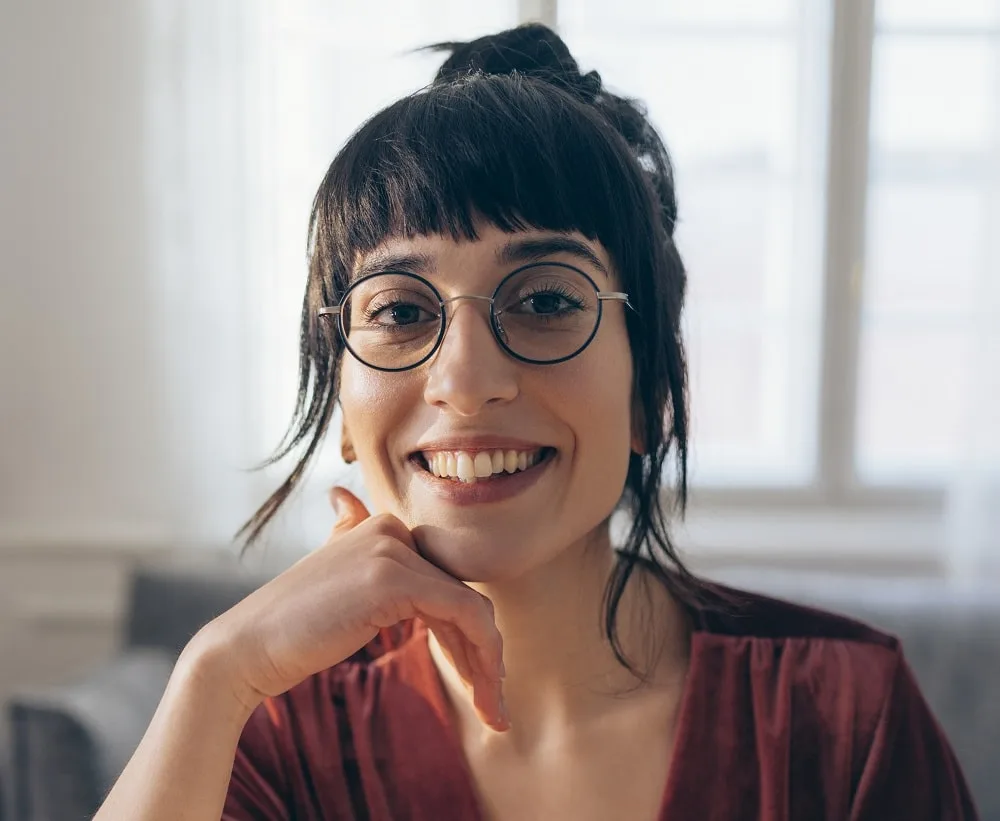 Face-framing bangs for square faces with glasses