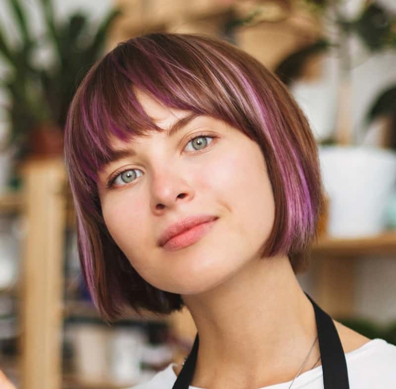 brown hair with faded purple highlights