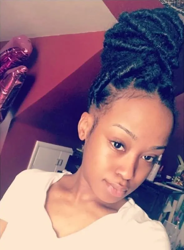 faux locs with curly bun 