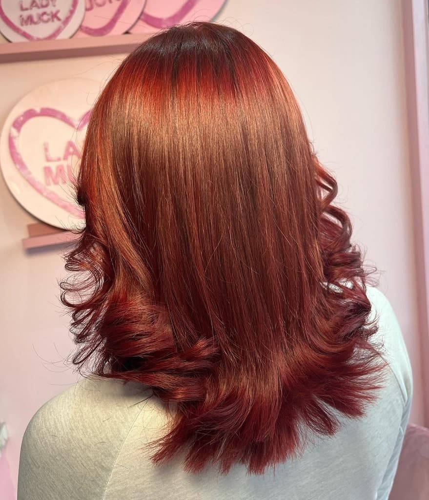 feathered auburn hair
