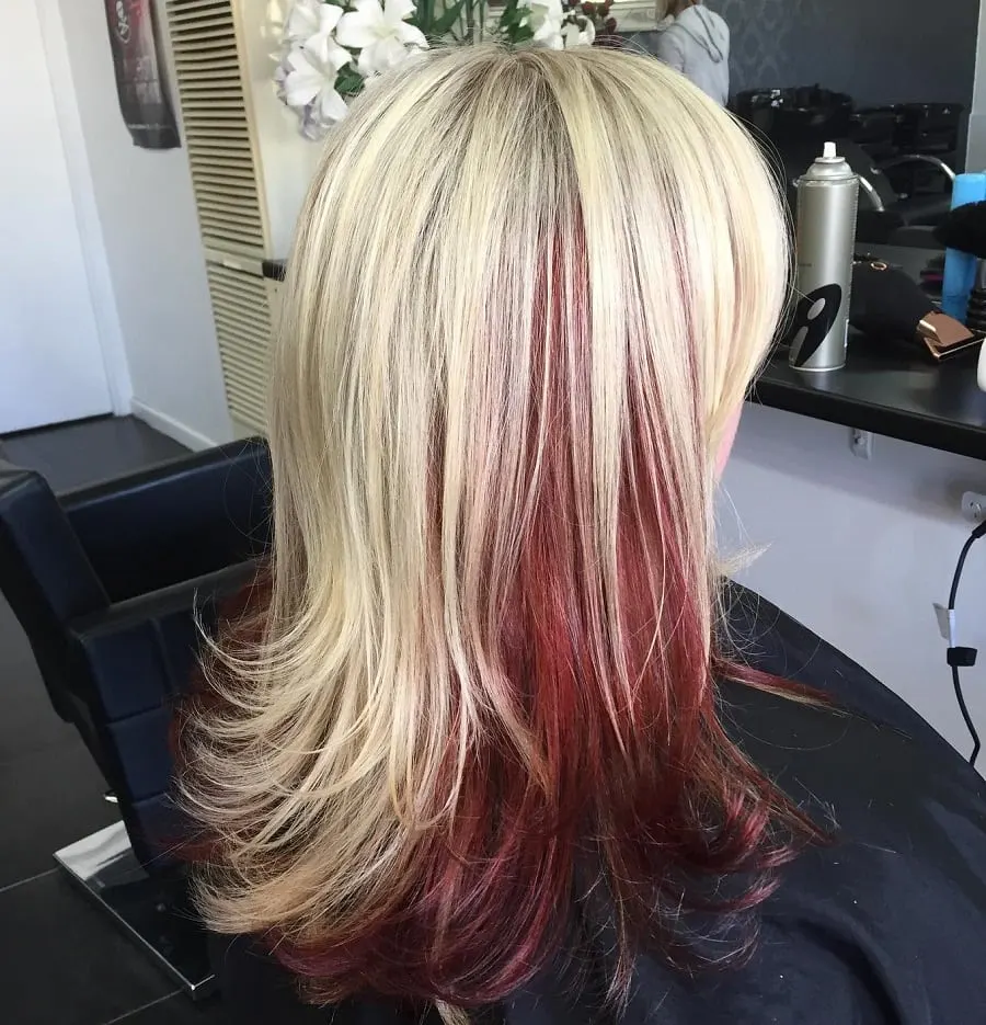 feathered blonde hair with red underneath